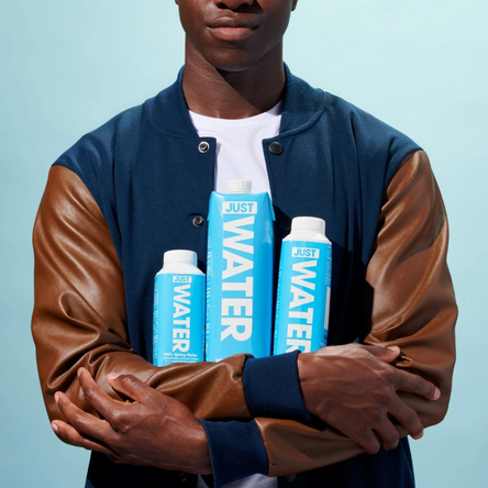 JUST Water coupons, MEN HOLDING THREE CARTON OF JUST WATER